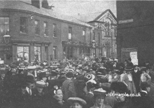 Crowds gather at the corner of Market Street and Stockport Road during Marple Carnival in 1906.