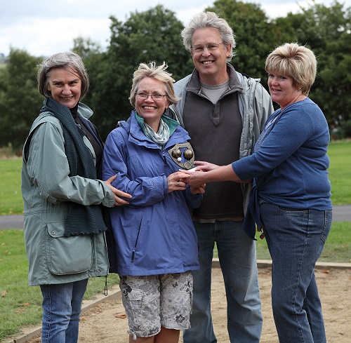 Kay Gould-Martin presents the trophy to Marple Civic Society's Gillian Postill, Jane and Graham Clarke