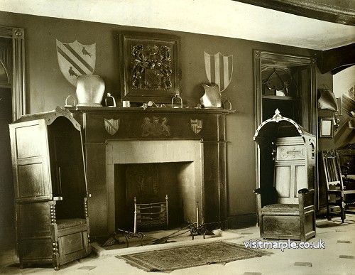 The fireplace and amazing chairs in the entrance hall of Marple Hall in 1919.