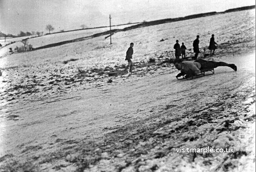 Tom Oldham sledging on Ale House Brow in the 1930s