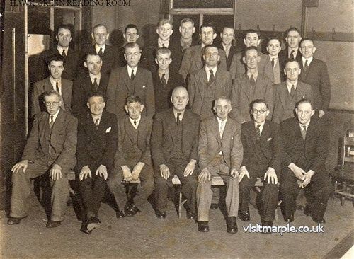 A group of gentlemen in the Hawk Green reading Rooms around 1945.